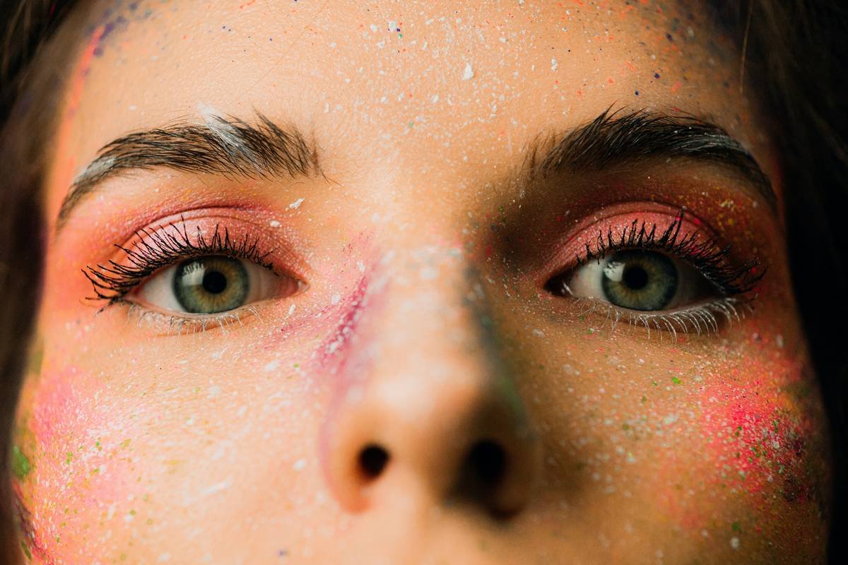Side-by-side comparison: FDA-compliant special effects face paint vs. unsafe craft paint showing ingredient labels and skin reaction risk