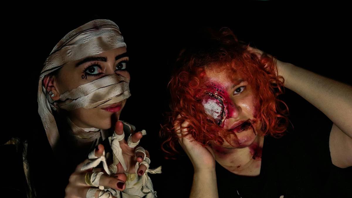 Close-up of realistic SFX makeup for zombies showing layered textures and shadow depth